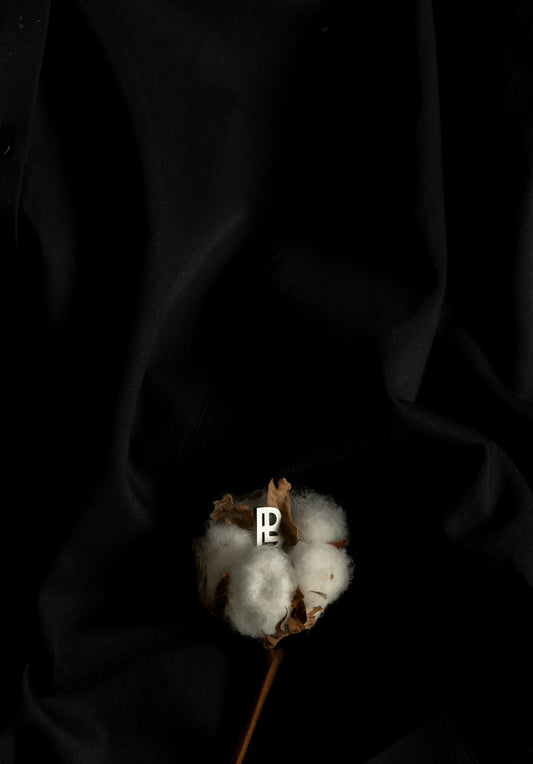 a cotton plant with the letter p on it
