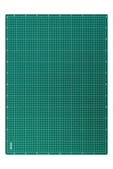 Green desk mat with white grid and rulers